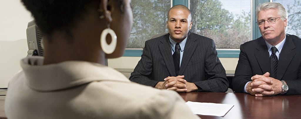 Photo of woman being questioned