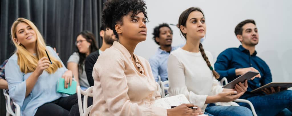 Photo of diverse employees attending a training session.
