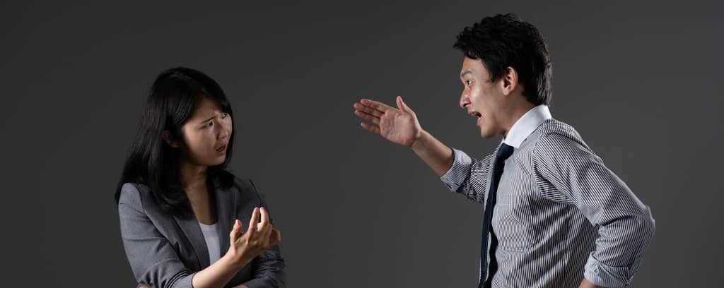 Photo of two people arguing