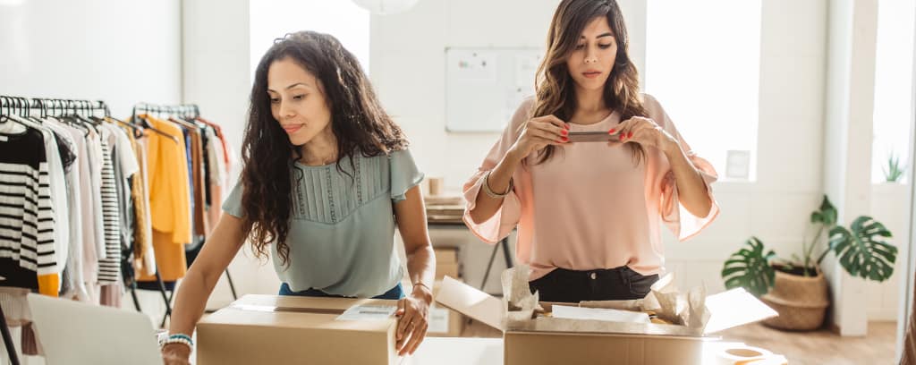 Small business owners shipping orders for their products.