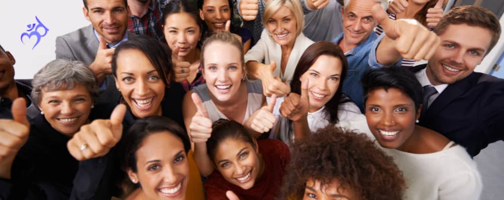 Photo of smiling employees of a variety of backgrounds and identities