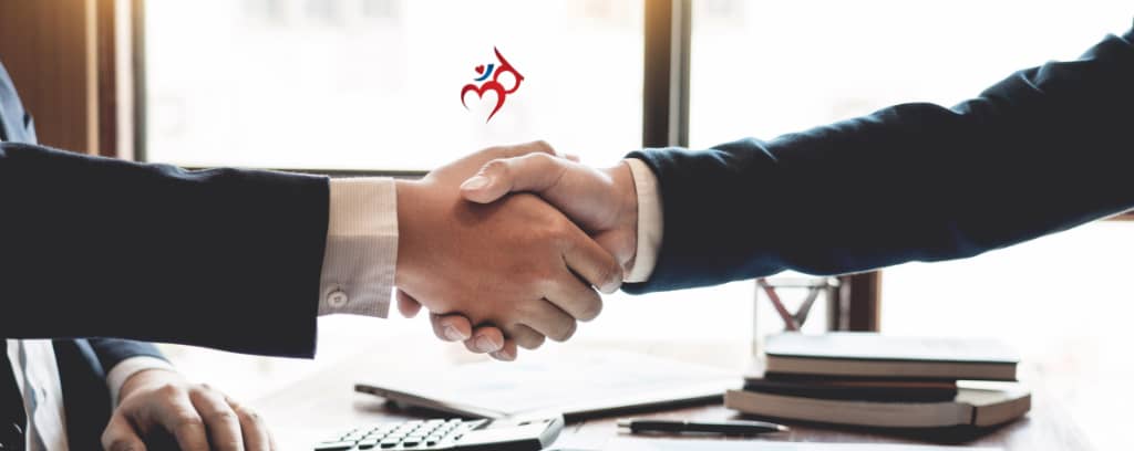 Photo of funeral director and contractor shaking hands