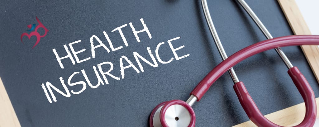 Photo of maroon stethoscope and chalkboard reading "Health Insurance"