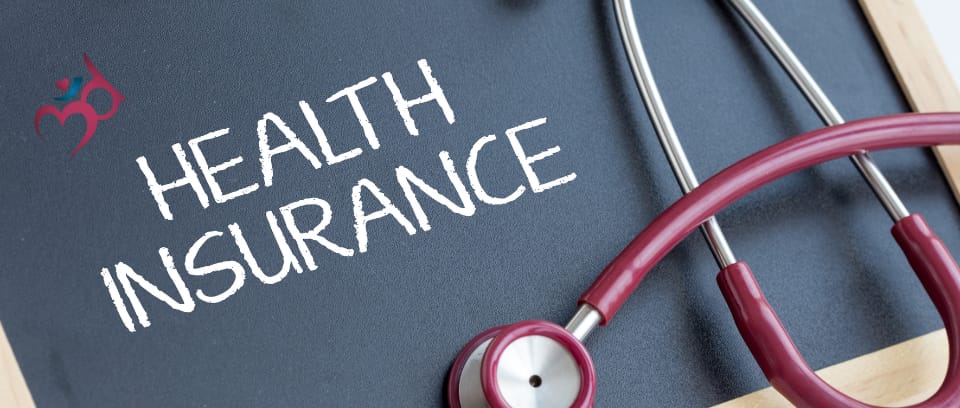 Photo of maroon stethoscope and chalkboard reading "Health Insurance"