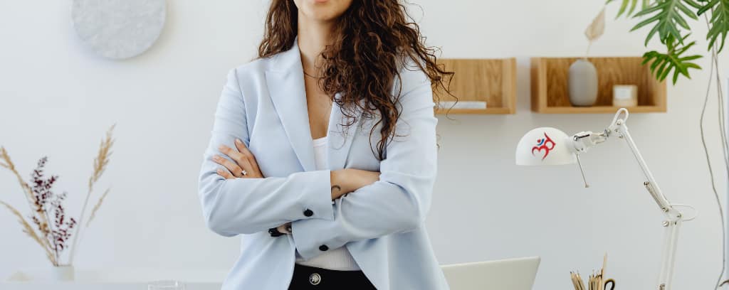 Photo of executive in power pose with arms crossed