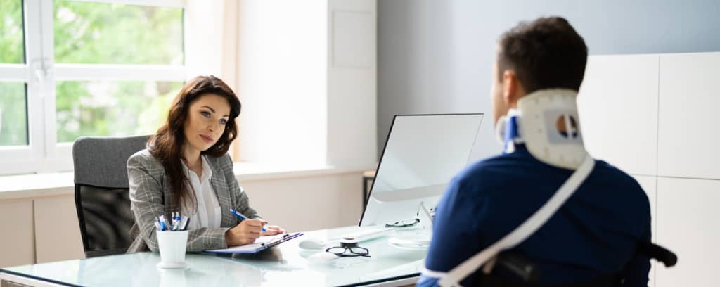 Photo of lawyer interviewing injured worker