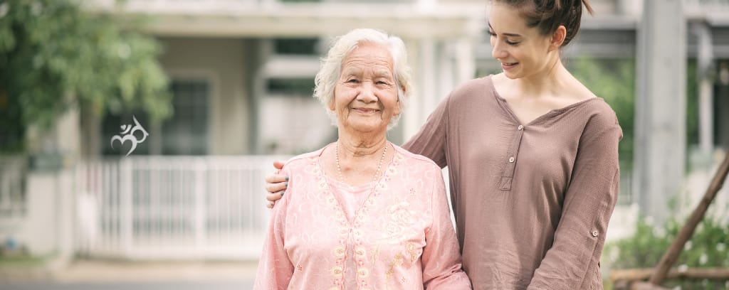 Photo of elder companion with arm around smiling client