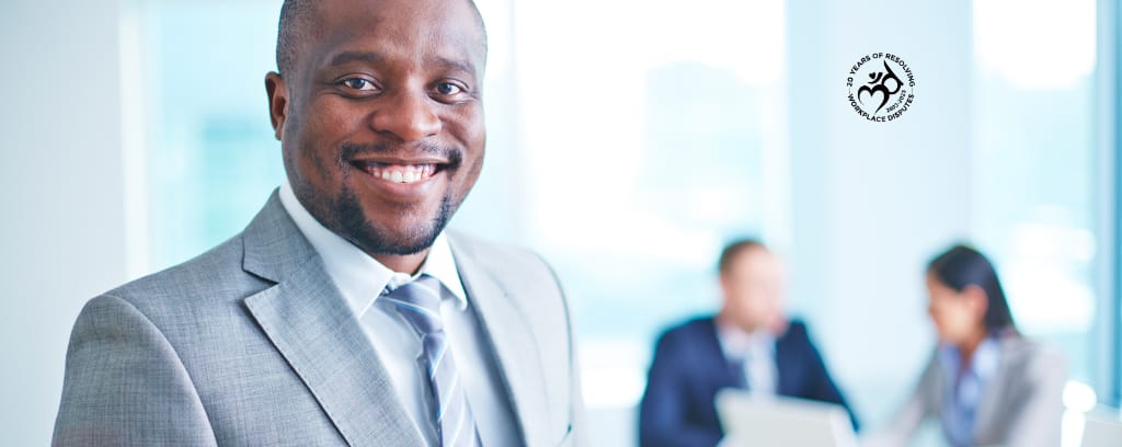 Photo of smiling employer wearing a suit