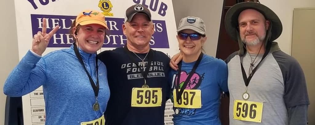 Photo of Nance L. Schick, Nina Kaufman, Joe Carr, and Peter Schmitz after Yorktown 5K run