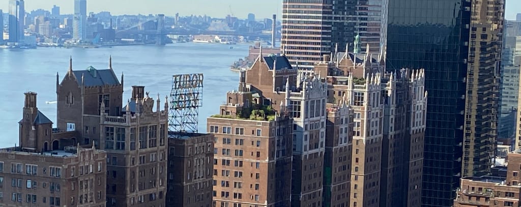 Photo of NYC's Tudor City and East River from atop a residential building