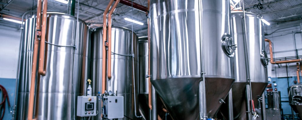 Photo of various tanks in a brewery