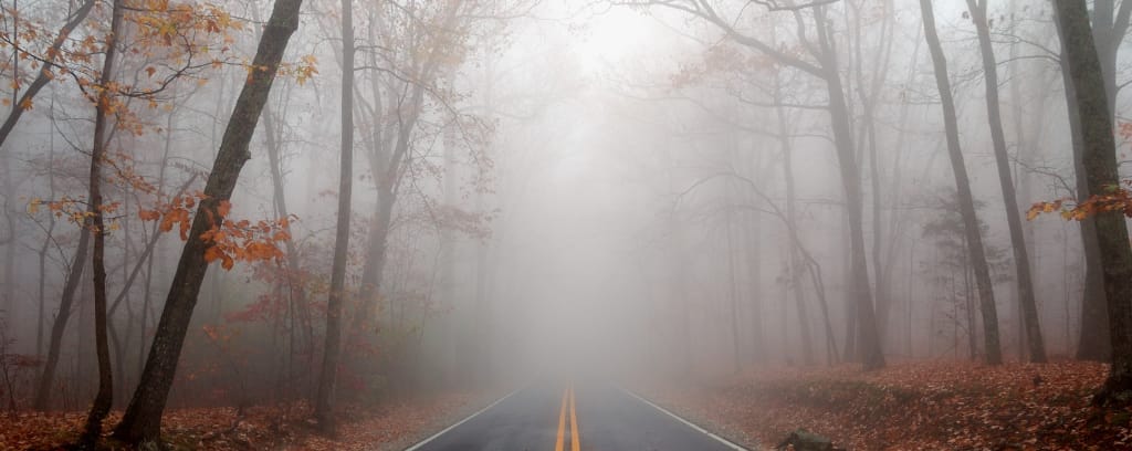 Photo of road obscured by fog